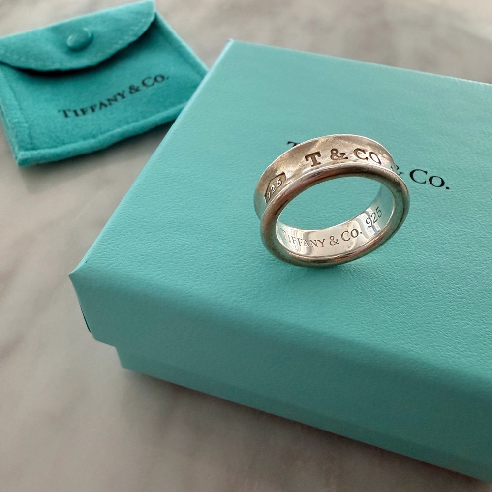 Tiffany & Co. Silver Logo Band Ring with Signature Blue Pouch